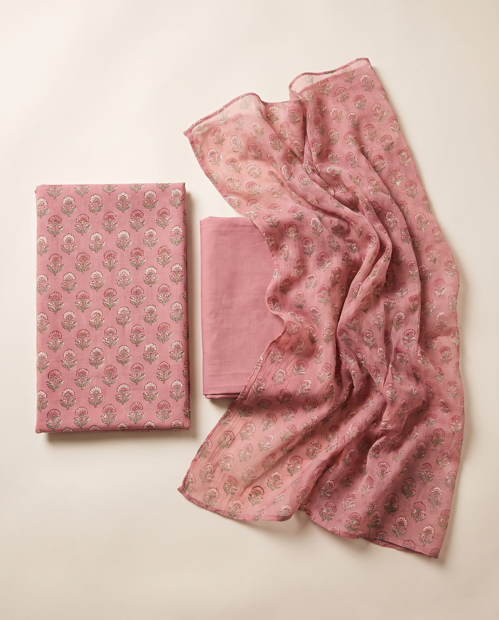 Printed lawn suit in dusty rose laid flat with matching chiffon dupatta